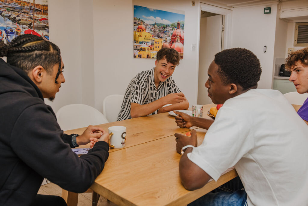 four students playing a game