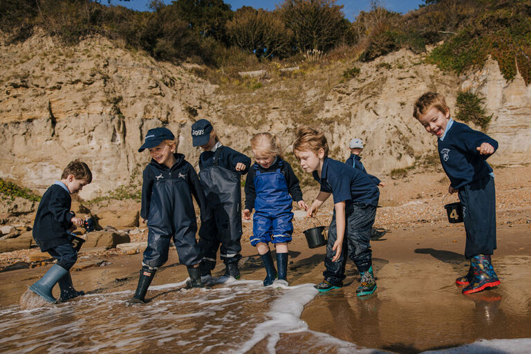 students playing with the sea