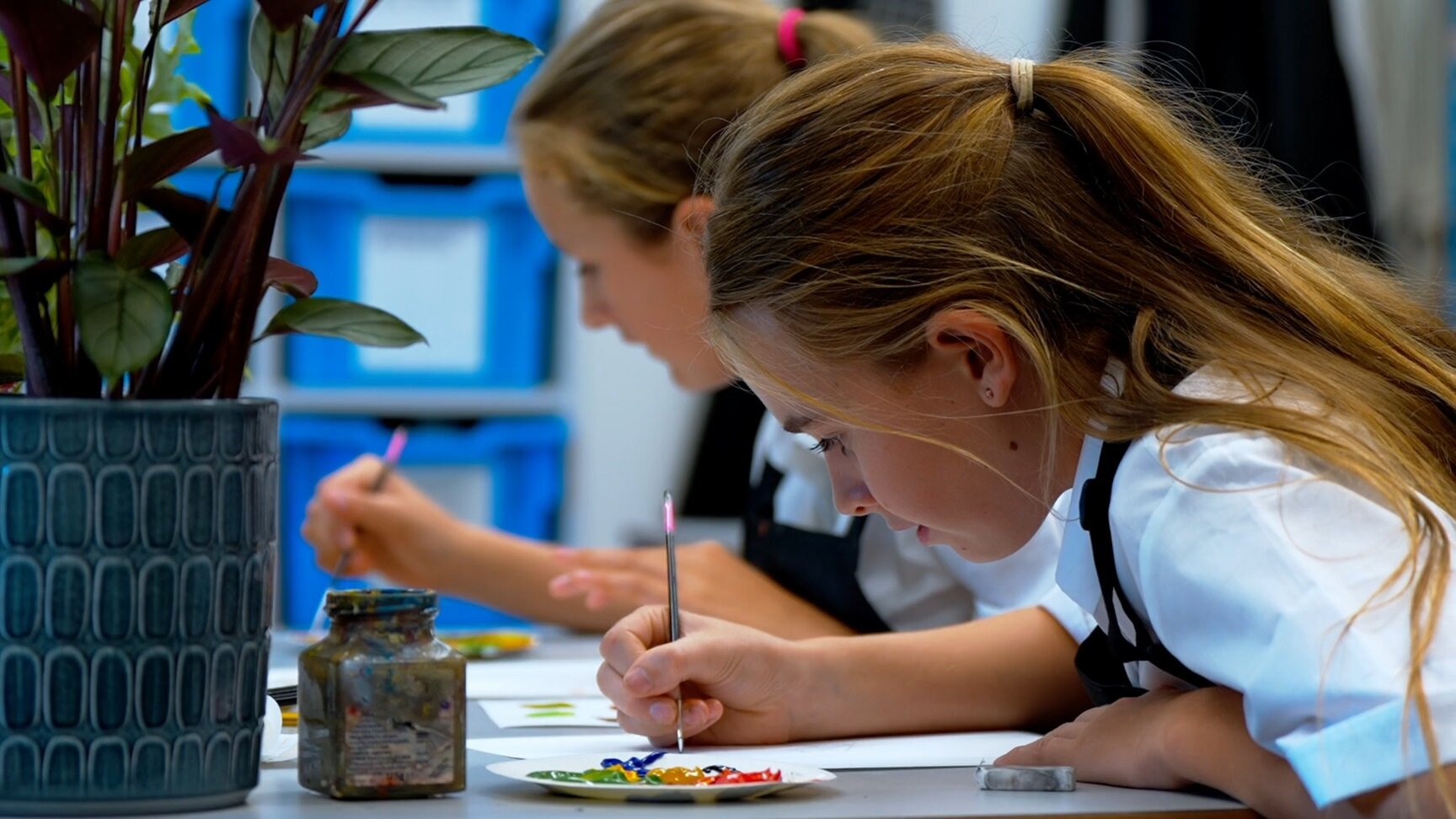 two students painting