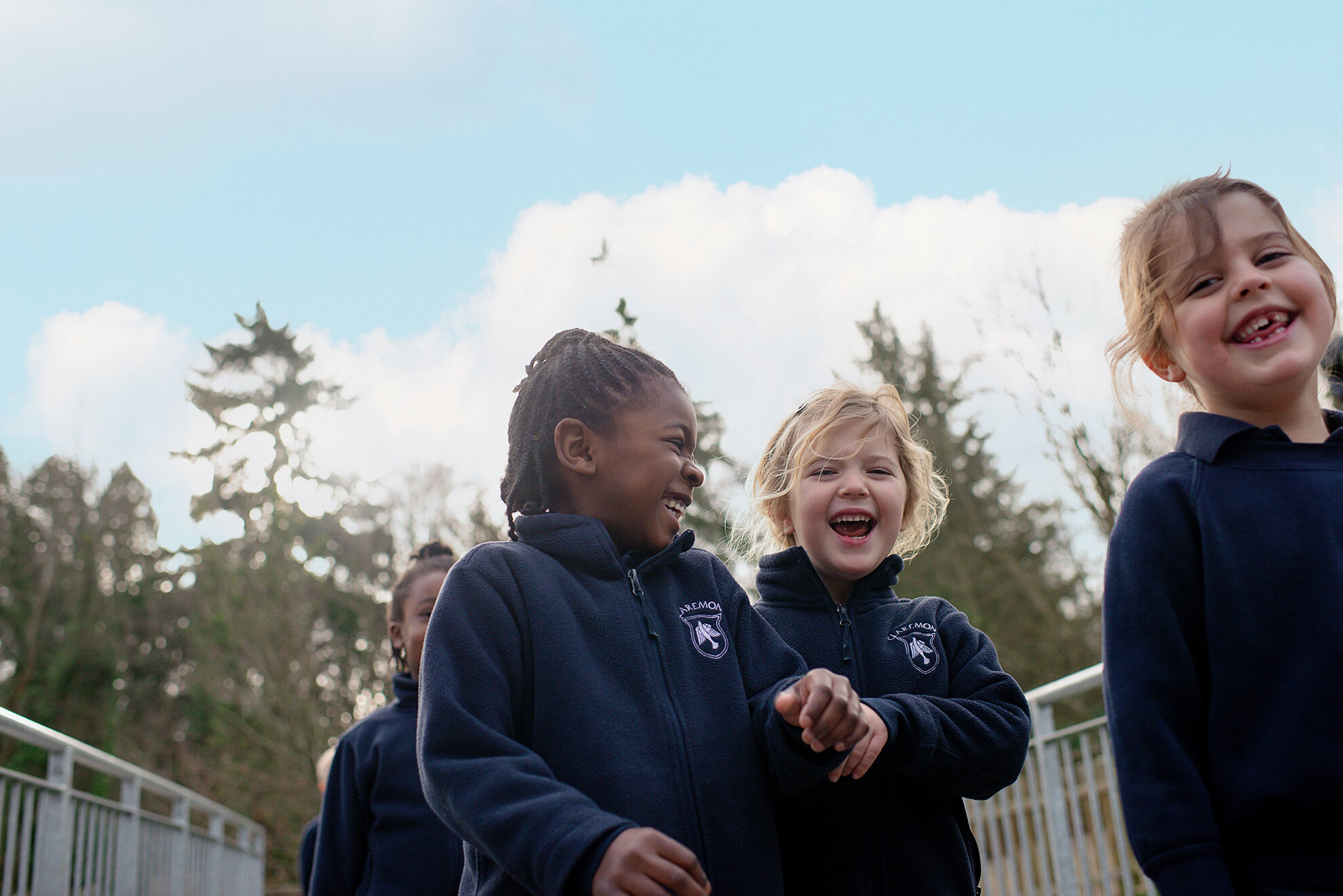 three students smiling