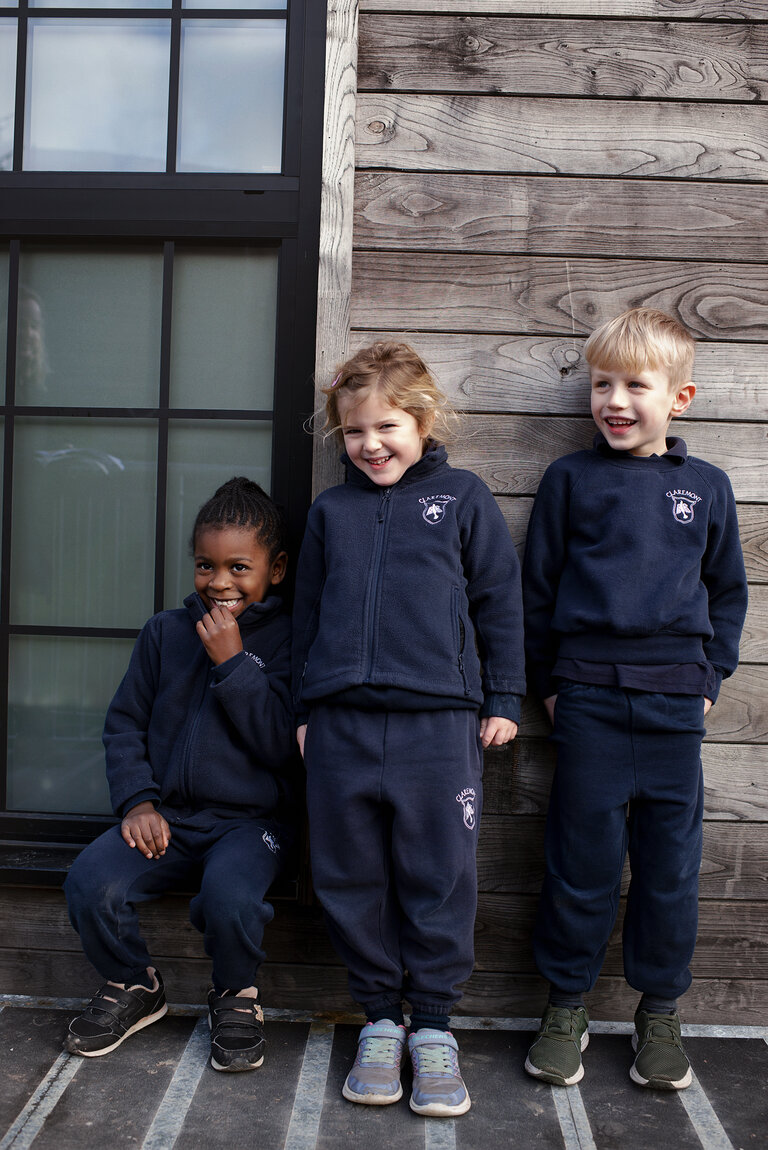 three students smiling