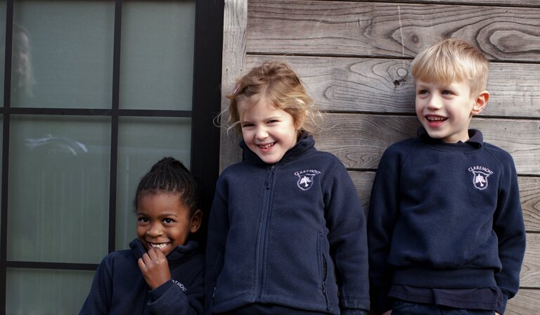 three students smiling