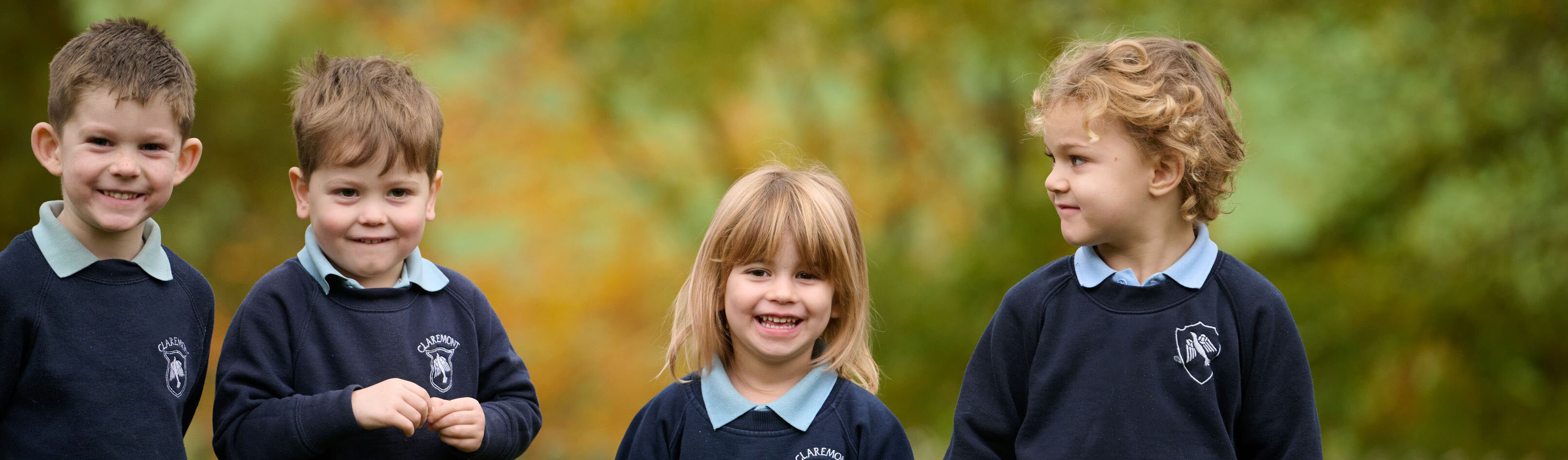 four students smiling 