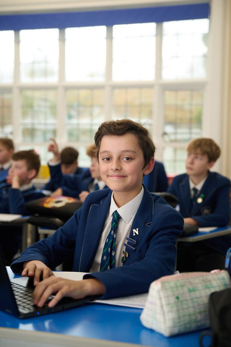 student smiling in the classroom